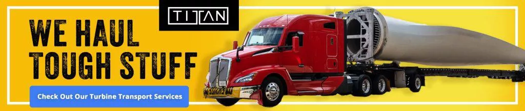 Red semi-truck hauling large turbine blade with Titan Transport Services branding on a yellow background.