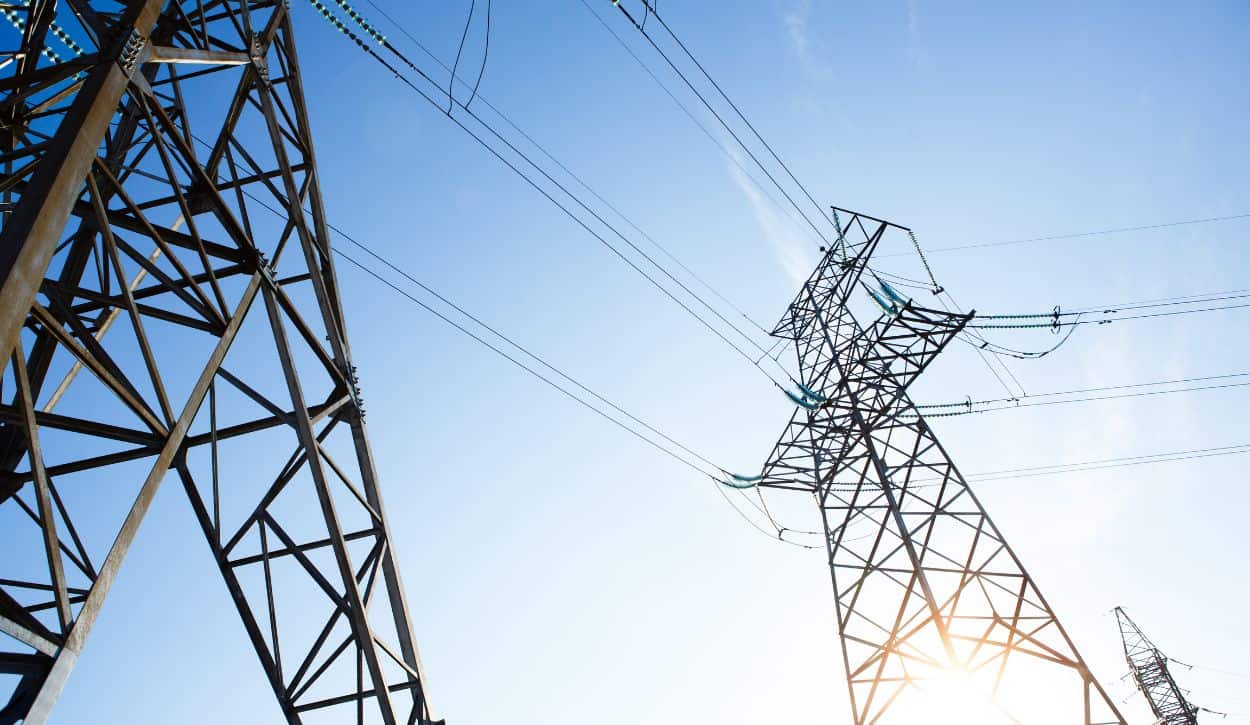 Picture of transmission towers and transmission lines at dusk