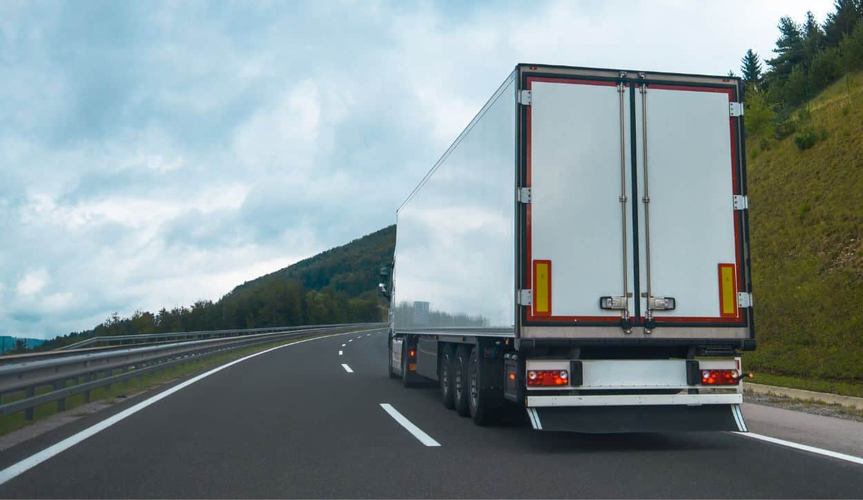 Semi truck driving on rural highway