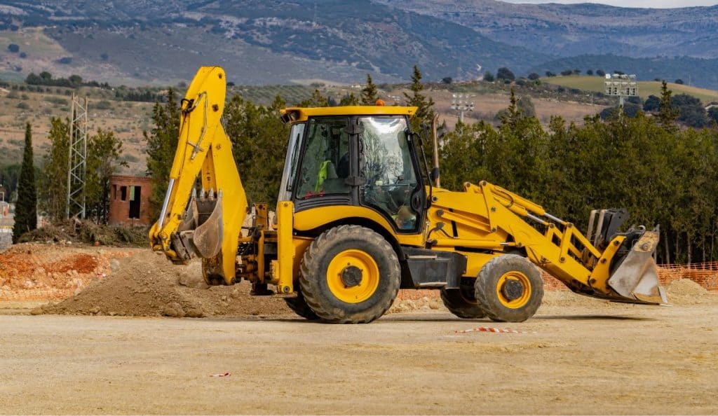 Backhoe loader parked on a construction site