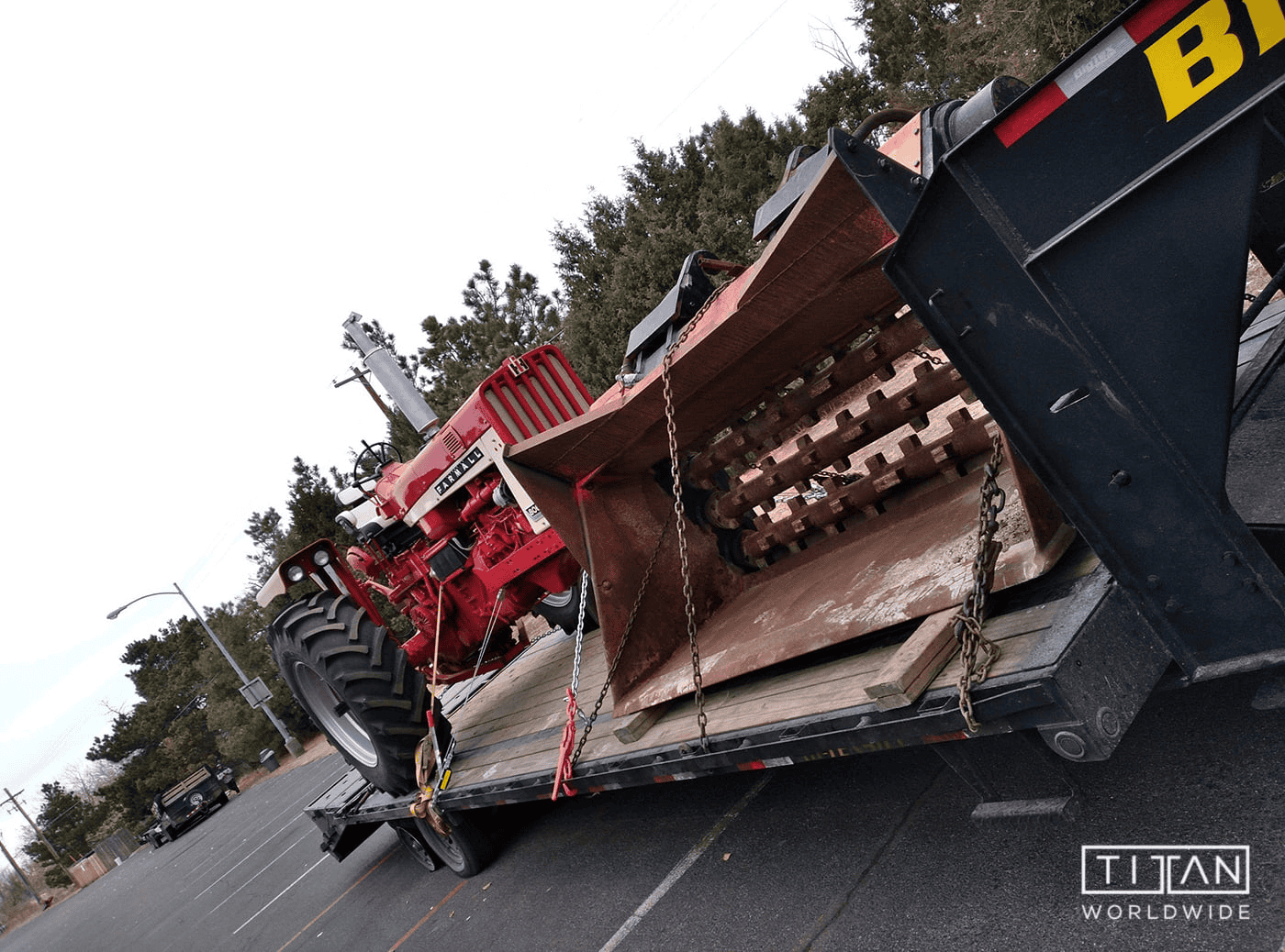 Red IHC Titan tractor on trailer