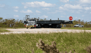Oversize load truck at rural intersection