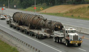 Oversize load truck hauling an industrial pressure vessel