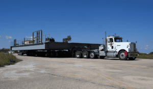 Oversize load semi truck with flatbed trailer