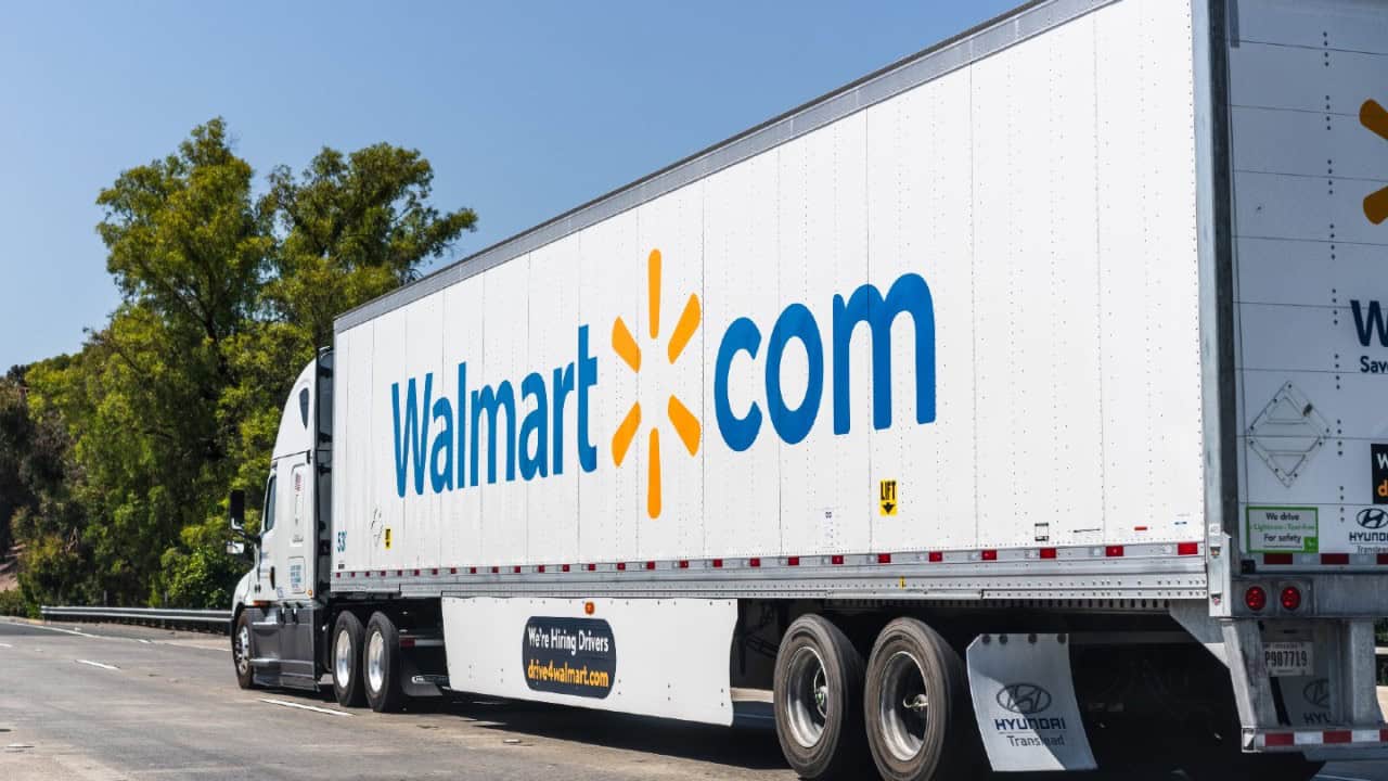 Walmart.com delivery truck on highway.